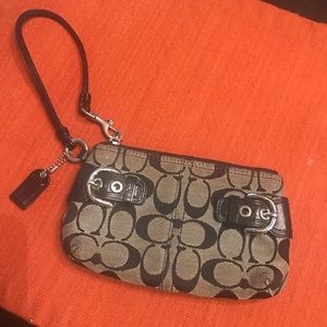 Coach printed wristlet with buckles